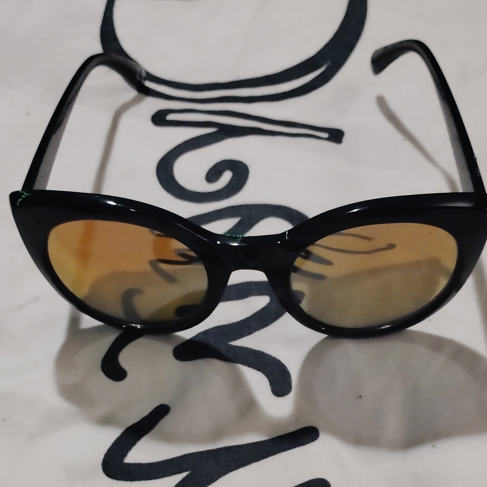 Elegant Black Sunglasses with Gold Lenses